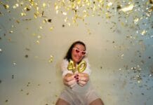 Woman celebrating 40th birthday with confetti