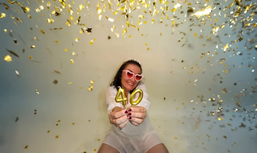 Woman celebrating 40th birthday with confetti